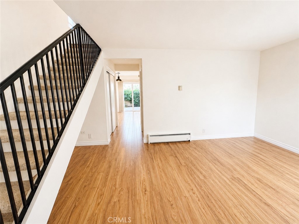 25 Brookfield Irvine, CA 92604 - Photo 3 of 17 a view of an empty room with wooden floor