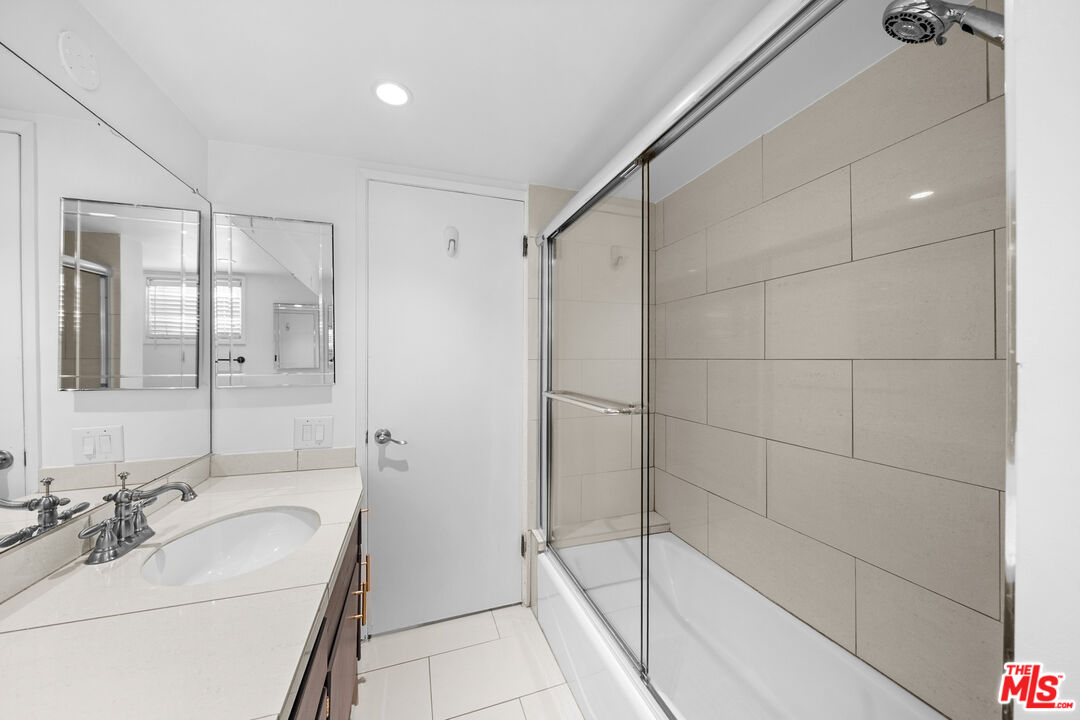 148 South Reeves Drive, Unit 4 Beverly Hills, CA 90212 - Photo 12 of 27 a bathroom with a sink a toilet and shower