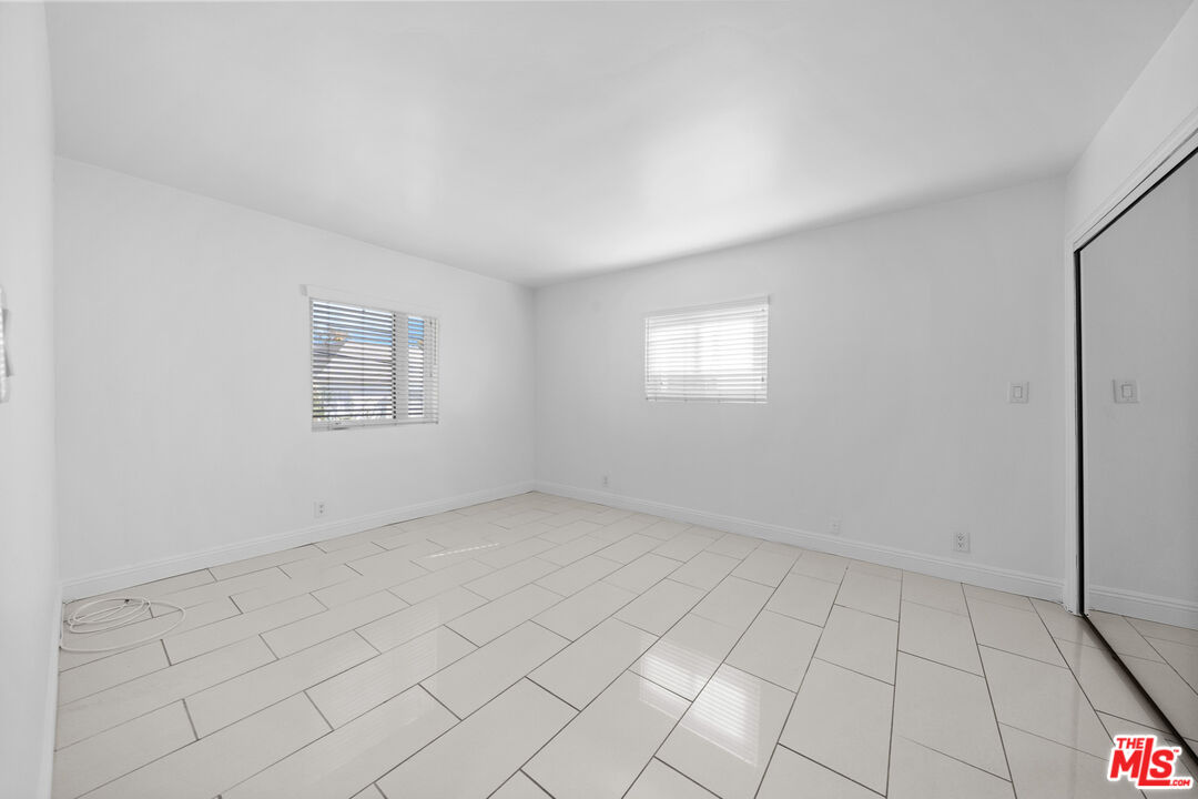 148 South Reeves Drive, Unit 4 Beverly Hills, CA 90212 - Photo 13 of 27 an empty room with windows