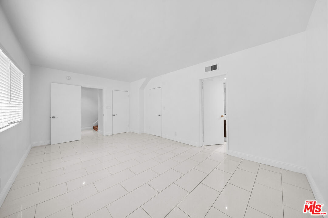 148 South Reeves Drive, Unit 4 Beverly Hills, CA 90212 - Photo 18 of 27 an empty room with white walls