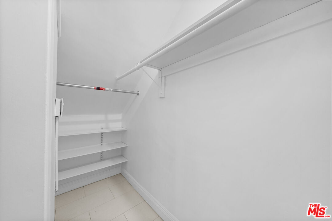 148 South Reeves Drive, Unit 4 Beverly Hills, CA 90212 - Photo 22 of 27 a view of an empty walk in closet