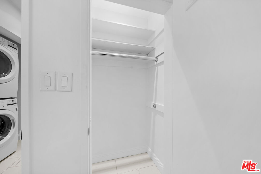 148 South Reeves Drive, Unit 4 Beverly Hills, CA 90212 - Photo 23 of 27 a utility room with dryer and washer