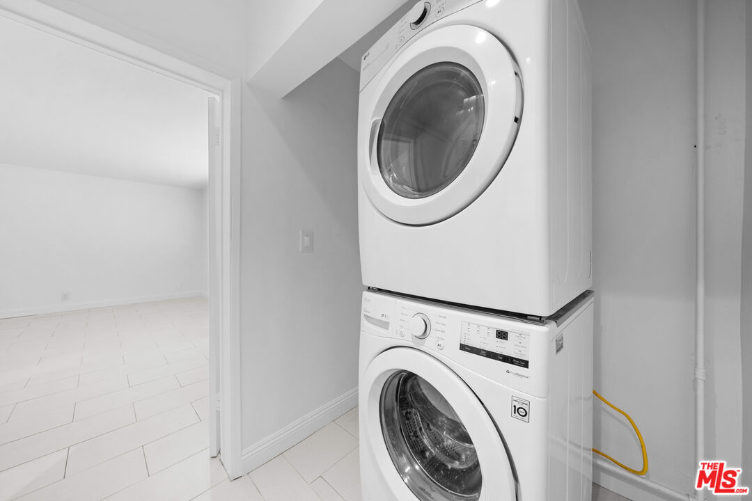 148 South Reeves Drive, Unit 4 Beverly Hills, CA 90212 - Photo 24 of 27 a utility room with dryer and washer