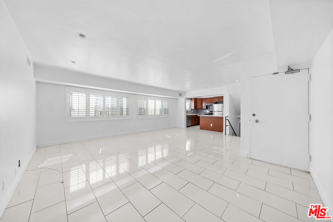 148 South Reeves Drive, Unit 4 Beverly Hills, CA 90212 - Photo 8 of 27 a view of an empty room with a window