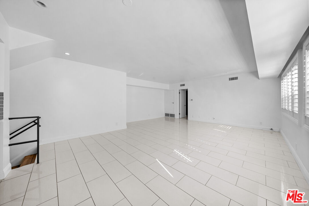 148 South Reeves Drive, Unit 4 Beverly Hills, CA 90212 - Photo 10 of 27 wooden floor in an empty room with a window