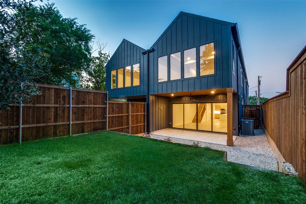 4515 Afton Street Dallas, TX 75219 - Photo 24 of 25 a view of a backyard with a cabin and wooden fence
