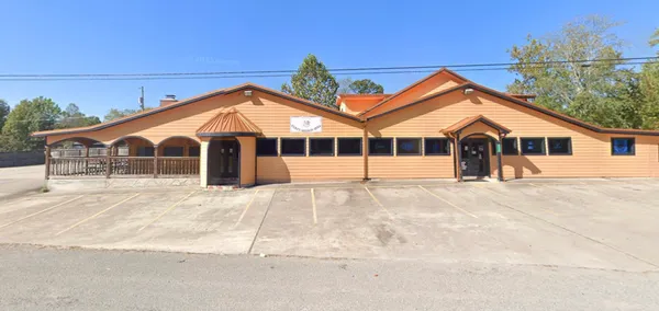 a front view of a house with a garage