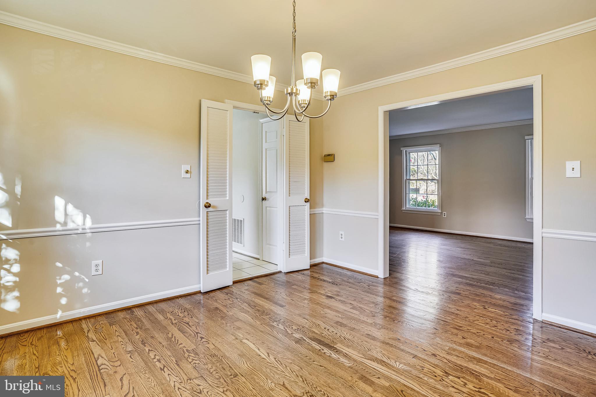 10186 Red Spruce Road Fairfax, VA 22032 - Photo 10 of 60 Chair railing and crown molding in dining room.