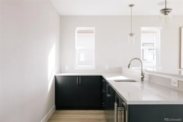 a kitchen with a sink and cabinets