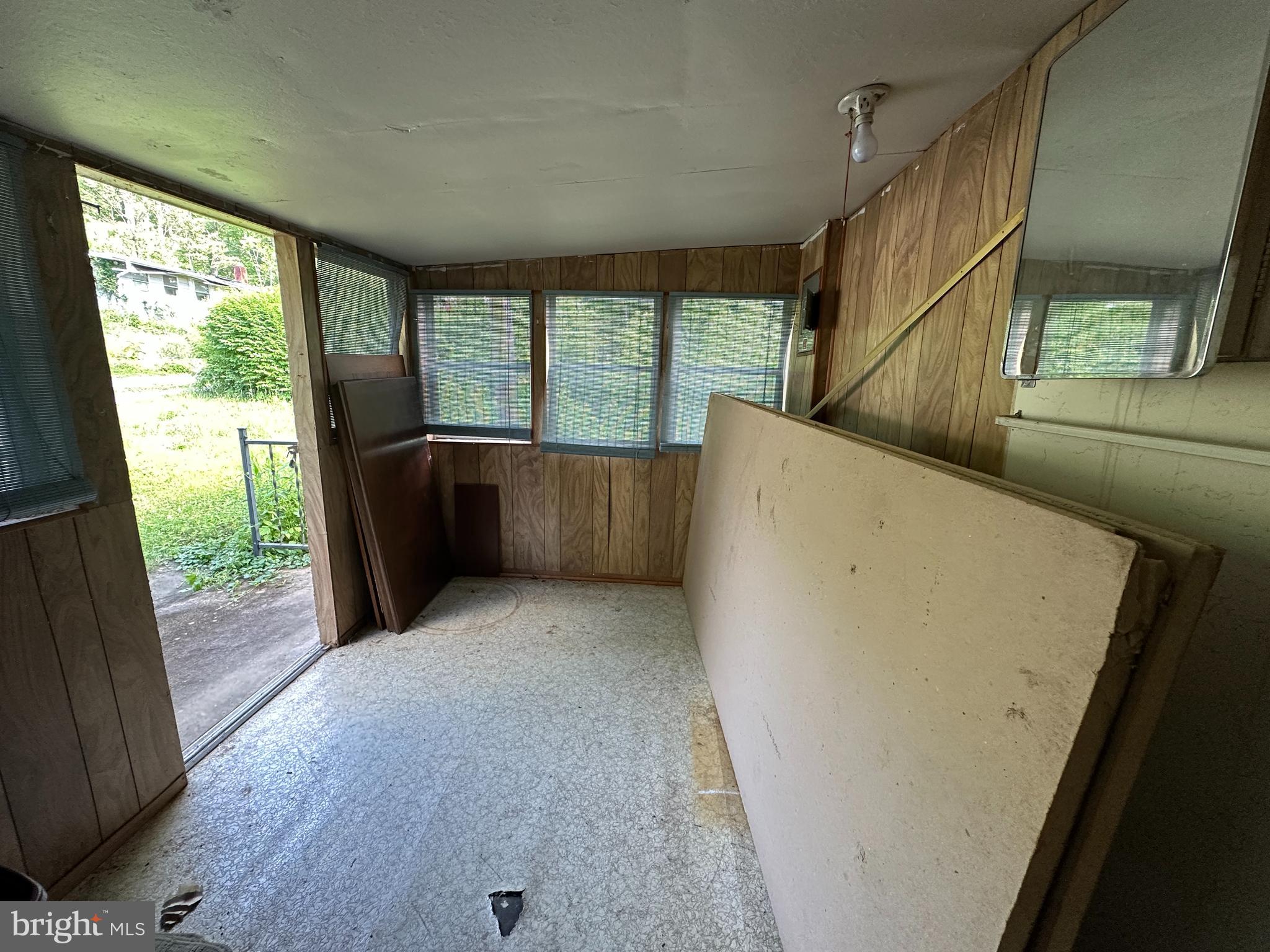 13726 Hopps Landing Road Hagerstown, MD 21740 - Photo 22 of 71 a view of an empty room with wooden floor and a window