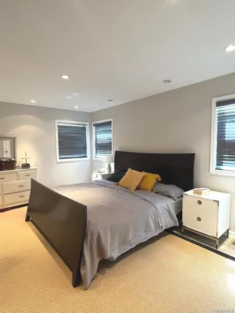 a bedroom with a bed and a couch