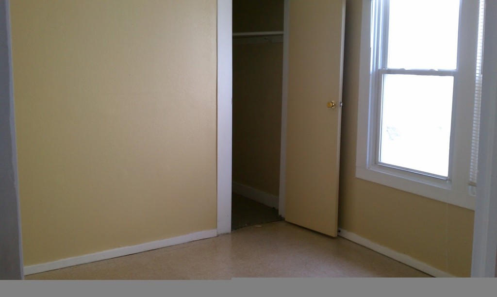 56 Windsor Street Springfield, MA 01105 - Photo 14 of 14 a view of an empty room with a window