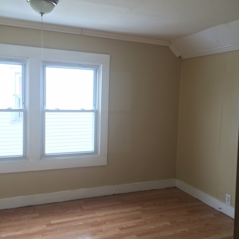 56 Windsor Street Springfield, MA 01105 - Photo 9 of 14 an empty room with a window