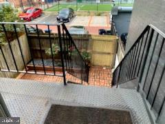1721 Corcoran Street Northwest Washington, DC 20009 - Photo 6 of 14 Back stairs to brick patio and 2 parking spaces