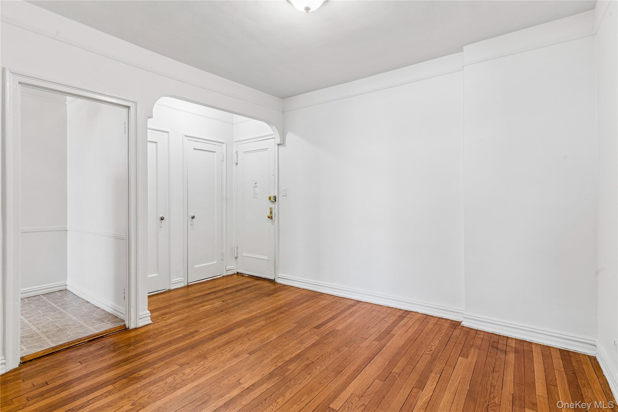 111-39 76th Road, Unit D8 Queens, NY 11375 - Photo 7 of 17 View of foyer and entry to kitchen