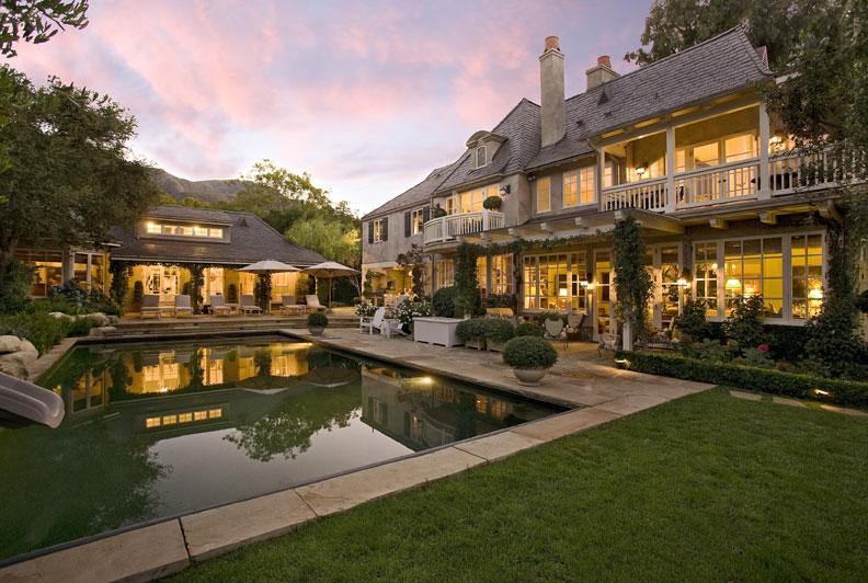 a view of a house with a swimming pool