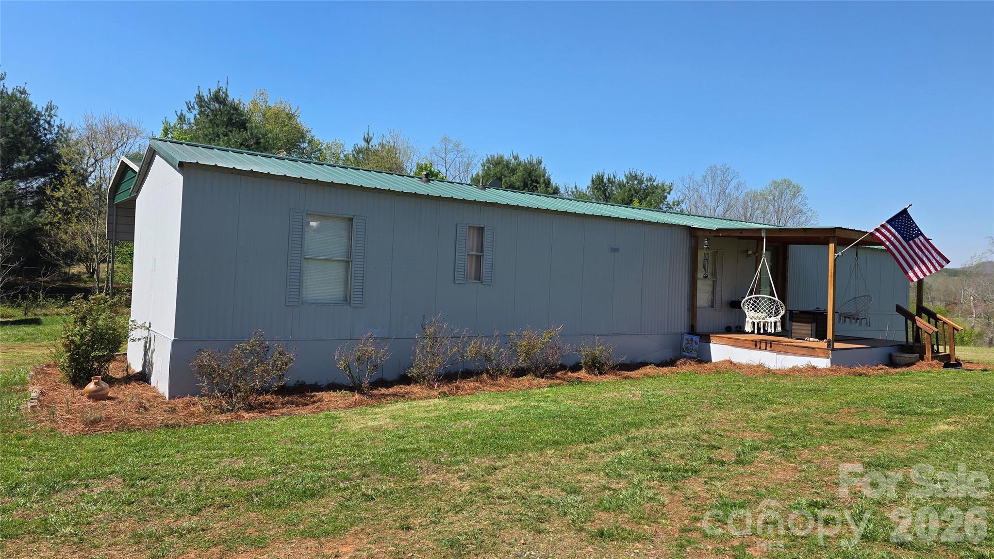 5431 Polkville Road Casar, NC 28020 - Photo 1 of 24 a backyard of a house with table and chairs