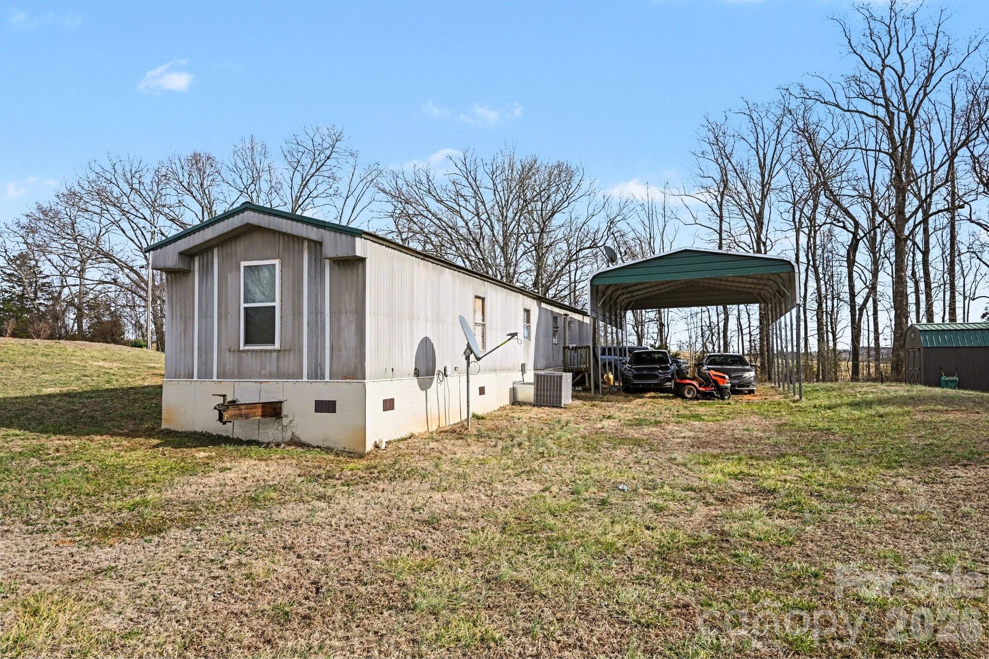5431 Polkville Road Casar, NC 28020 - Photo 23 of 24 a view of a house with backyard and sitting area