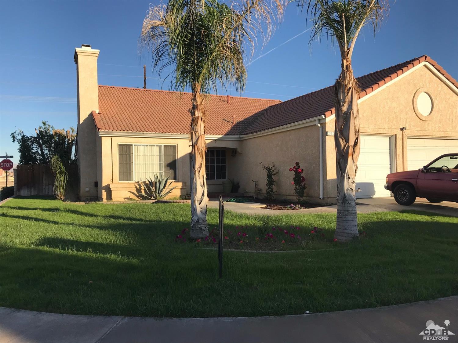 45544 Cimarron Road Indio, CA 92201 - Photo 2 of 5 a front view of house with yard and seating