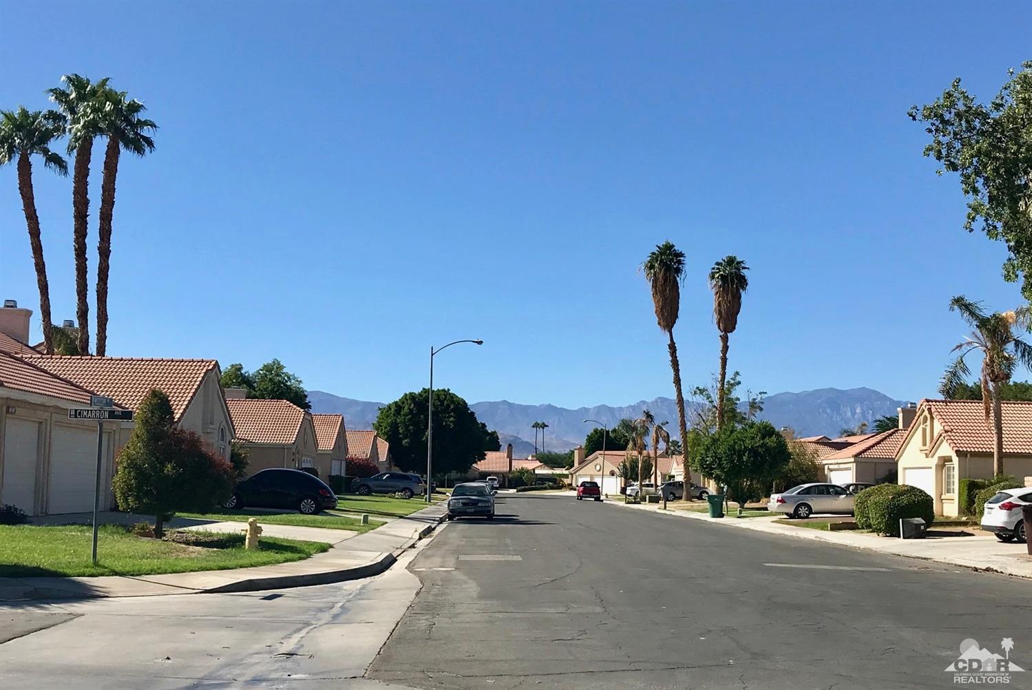 45544 Cimarron Road Indio, CA 92201 - Photo 4 of 5 a view of a street with palm trees