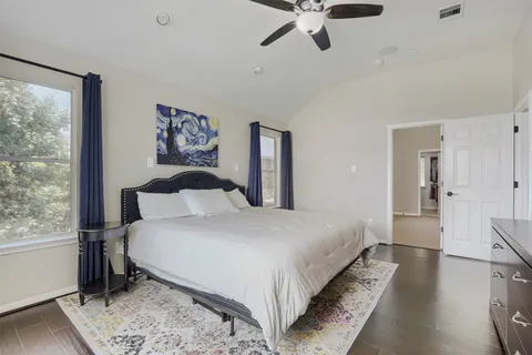 a bedroom with bed and window