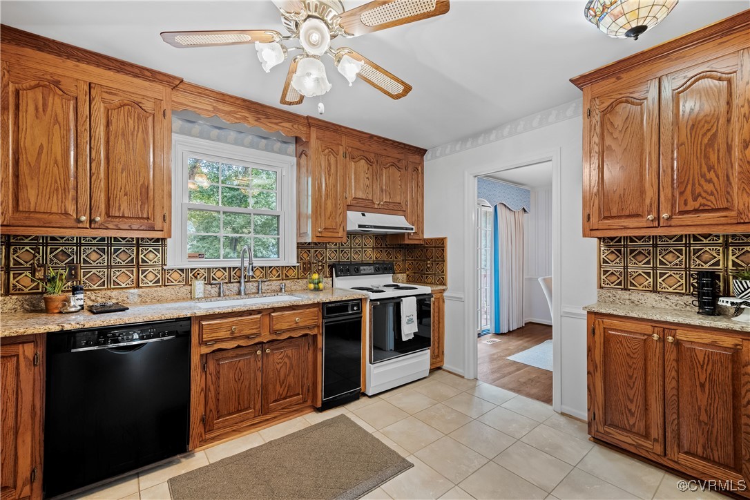 3510 Wood Dale Road Chester, VA 23831 - Photo 11 of 50 a kitchen with stainless steel appliances granite countertop a stove sink and cabinets