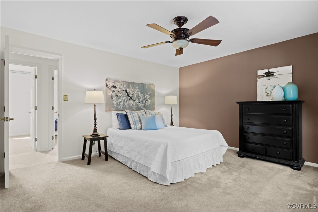 3510 Wood Dale Road Chester, VA 23831 - Photo 20 of 50 a bedroom with a bed and a chandelier