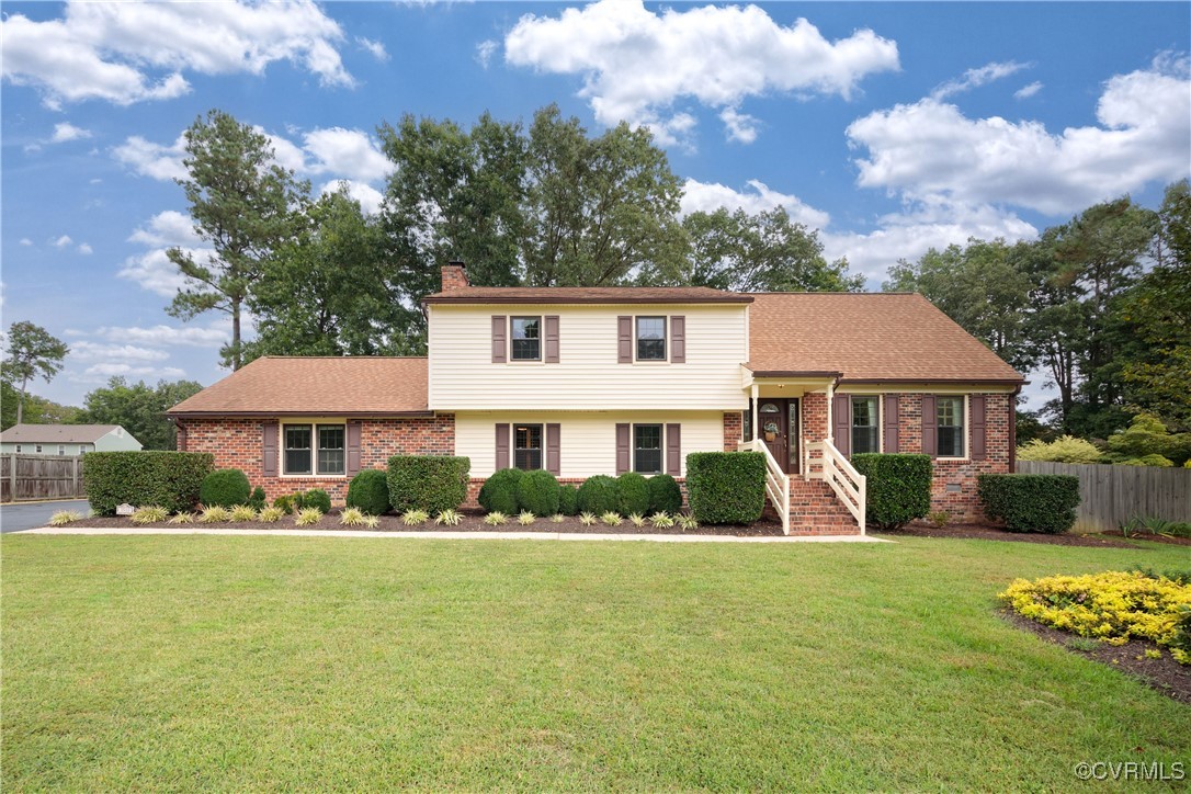 3510 Wood Dale Road Chester, VA 23831 - Photo 2 of 50 a front view of a house with a yard