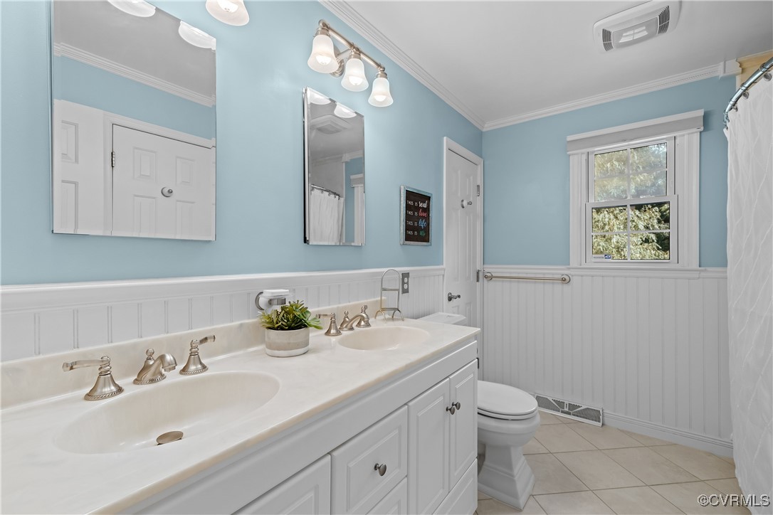 3510 Wood Dale Road Chester, VA 23831 - Photo 22 of 50 a bathroom with a toilet sink and mirror