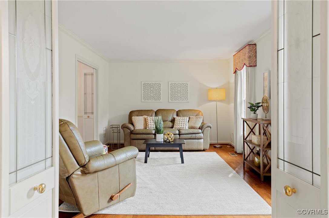 3510 Wood Dale Road Chester, VA 23831 - Photo 6 of 50 a living room with furniture and a chandelier
