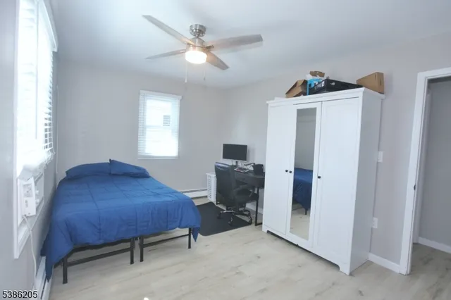 a bedroom with furniture and window