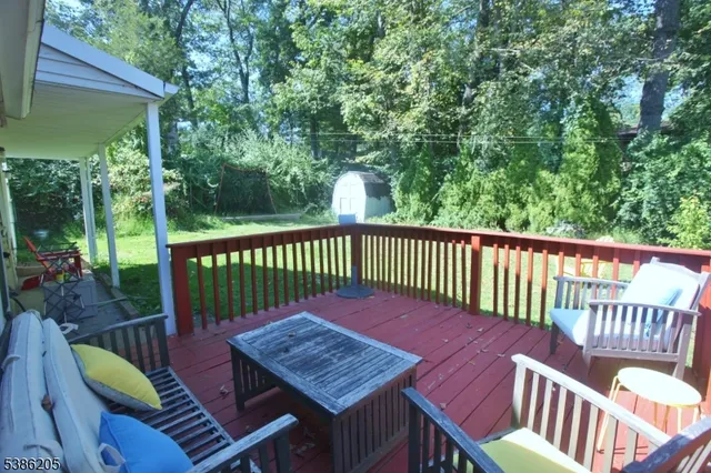 a view of a wooden deck with a bench