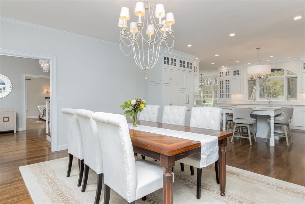 326 Old Ayer Road Groton, MA 01450 - Photo 11 of 42 a view of a dining room with furniture and wooden floor