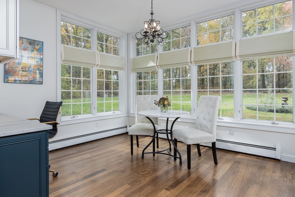 326 Old Ayer Road Groton, MA 01450 - Photo 13 of 42 a view of a dining room with furniture window and wooden floor