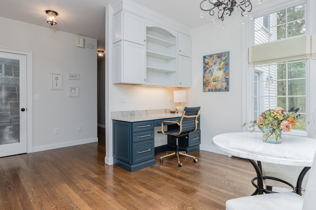 326 Old Ayer Road Groton, MA 01450 - Photo 14 of 42 a view of a workspace with furniture and a window