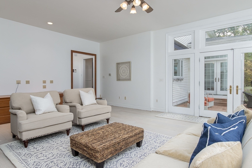 326 Old Ayer Road Groton, MA 01450 - Photo 17 of 42 a living room with furniture and a potted plant