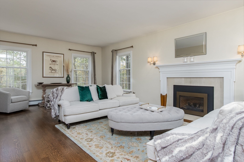 326 Old Ayer Road Groton, MA 01450 - Photo 21 of 42 a living room with furniture and a fireplace
