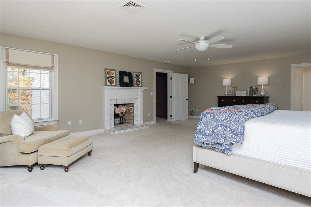 326 Old Ayer Road Groton, MA 01450 - Photo 24 of 42 a living room with furniture and a fireplace