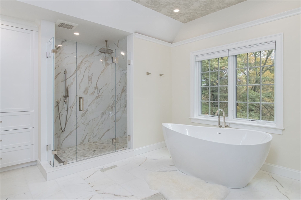 326 Old Ayer Road Groton, MA 01450 - Photo 25 of 42 a bathroom with a bathtub and shower