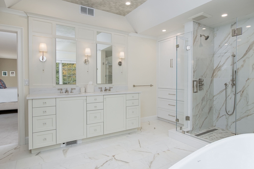 326 Old Ayer Road Groton, MA 01450 - Photo 26 of 42 a spacious bathroom with a shower sink and mirror