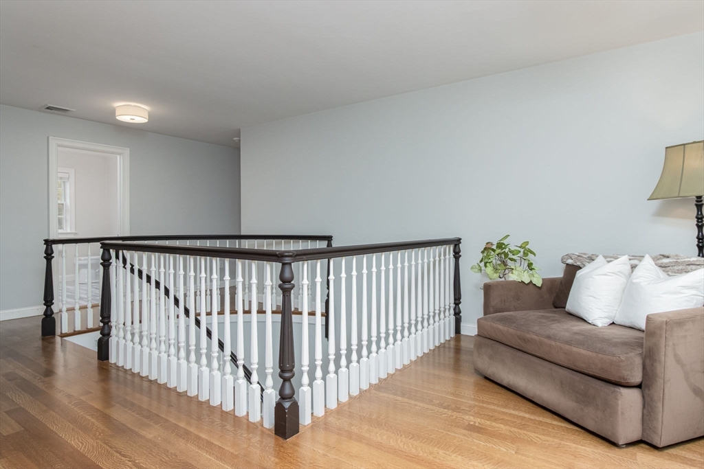 326 Old Ayer Road Groton, MA 01450 - Photo 32 of 42 a living room with furniture and wooden floor