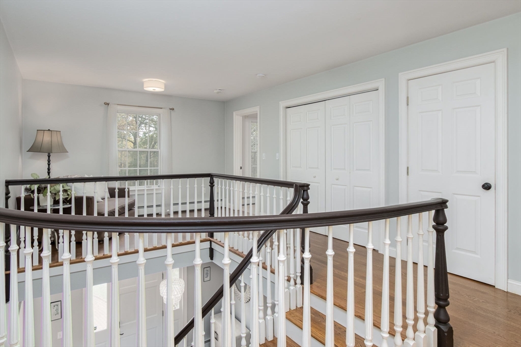 326 Old Ayer Road Groton, MA 01450 - Photo 33 of 42 a view of staircase with wooden floor and a window