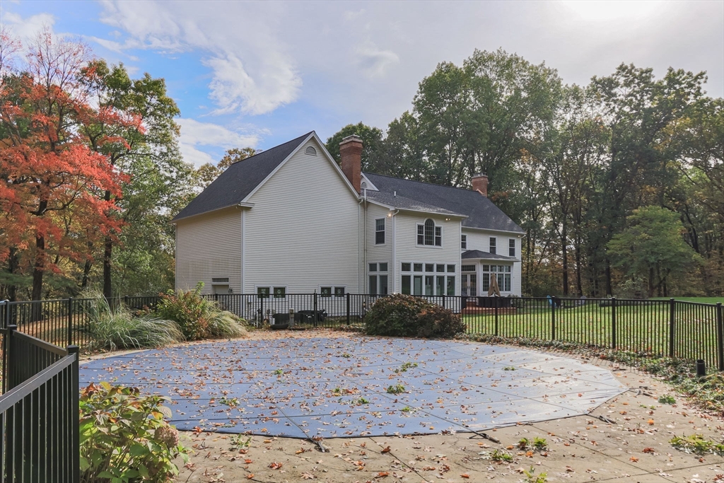 326 Old Ayer Road Groton, MA 01450 - Photo 36 of 42 a view of a house with a yard and sitting area