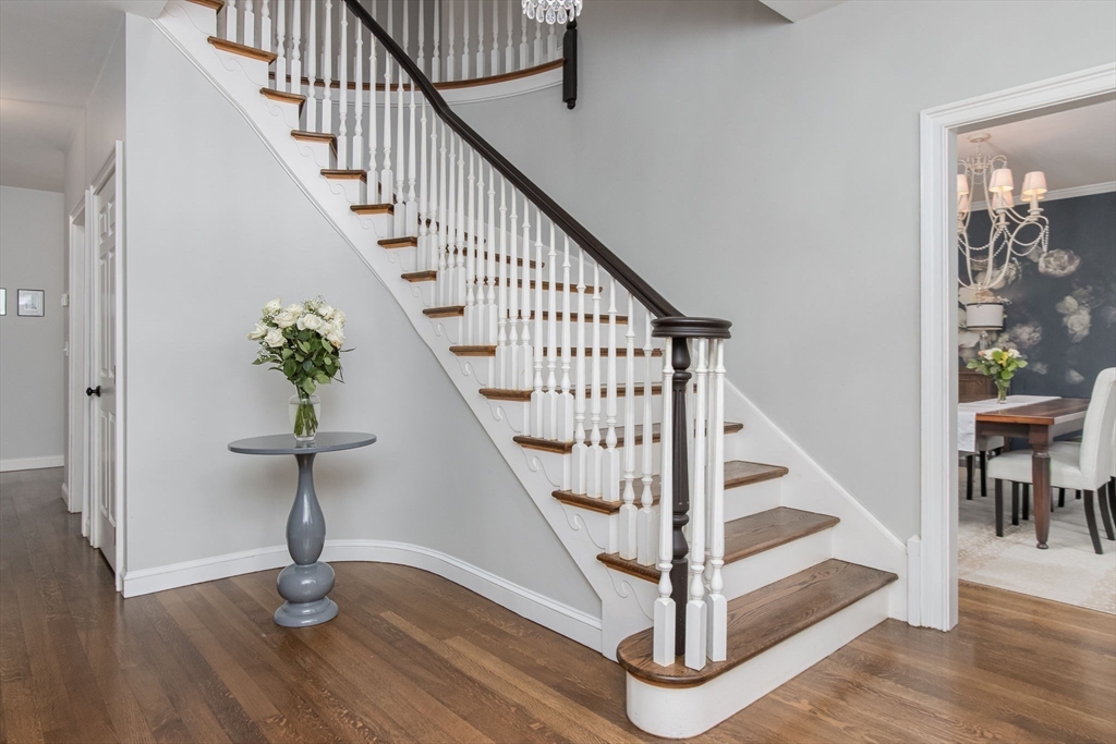 326 Old Ayer Road Groton, MA 01450 - Photo 4 of 42 a view of entryway with wooden floor and stairs