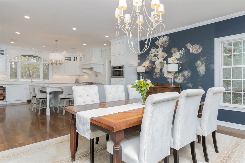 326 Old Ayer Road Groton, MA 01450 - Photo 10 of 42 a view of a dining room with furniture and chandelier