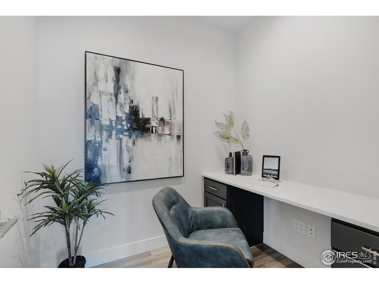 5706 3rd Street Greeley, CO 80634 - Photo 16 of 34 A unique pocket office right off the kitchen can serve many purposes: study, storage solution, wine vault, expanded pantry, etc.
