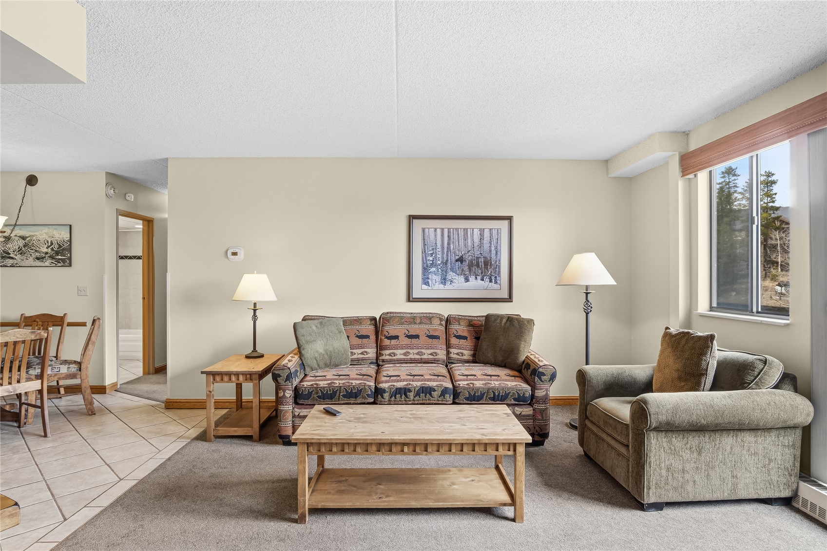 611 Village Road, Unit 24260 Breckenridge, CO 80424 - Photo 4 of 50 a living room with furniture a lamp and a potted plant