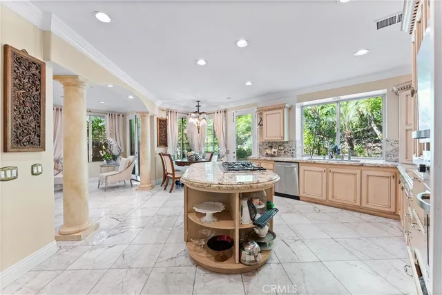 a kitchen with a sink and large window