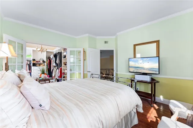 a bedroom with a bed and glass table