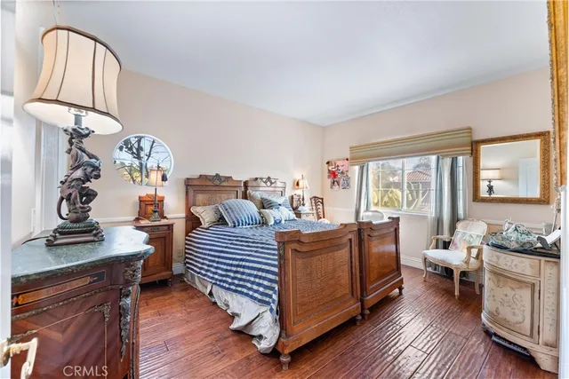 a living room with furniture fireplace and wooden floor